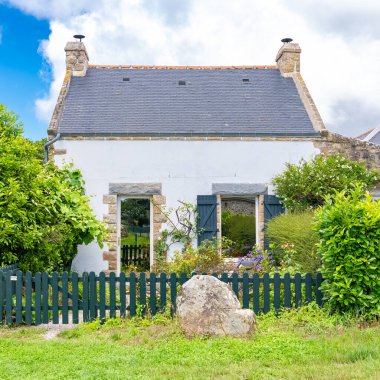 Carnac in Brittany, typical house in a stones field