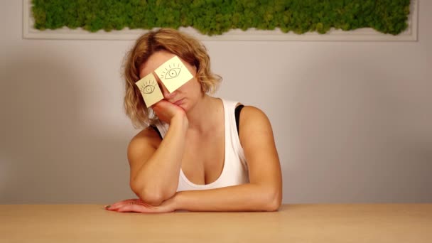 Young woman with stickers of yellow colour on forehead — Stock Video