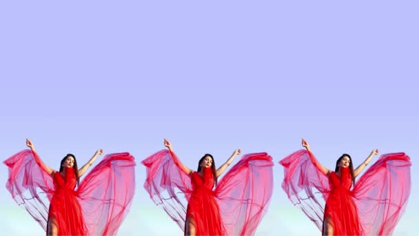 Young women in bright red dresses on purple background — 图库视频影像