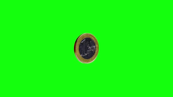 Shiny one euro coin with ribbed side on green background — Stock Video