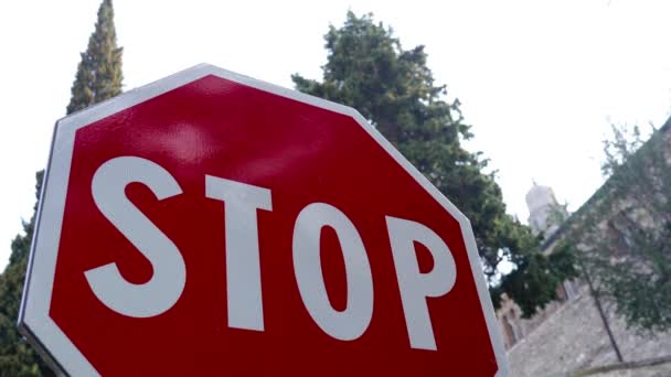 Large Stop road sign with white letters on red background — Stock Video