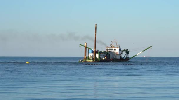 Industrial boat floats on the sea and throws out steam — Stock Video