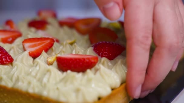 Cake with strawberries cut in two — Stock Video