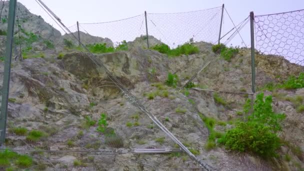 Wire mesh fences on the rocks of the mountain — 비디오