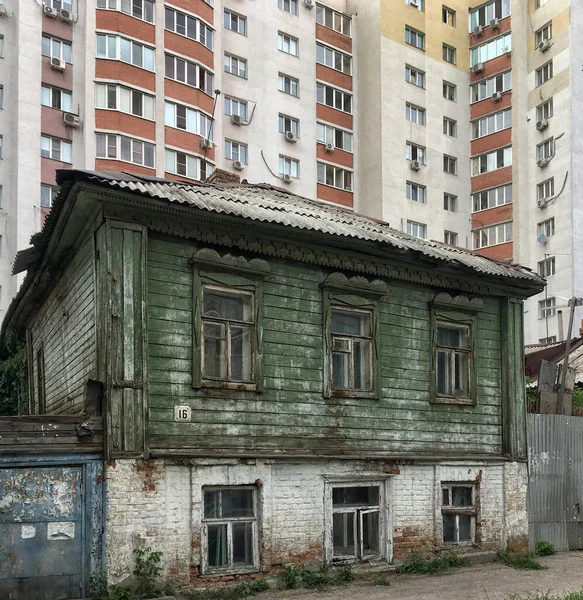 old wooden houses on the streets of Russian cities.