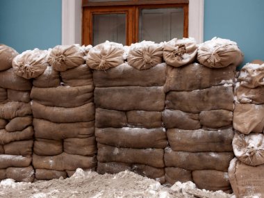 battle barricade of sandbags in front of the house. clipart