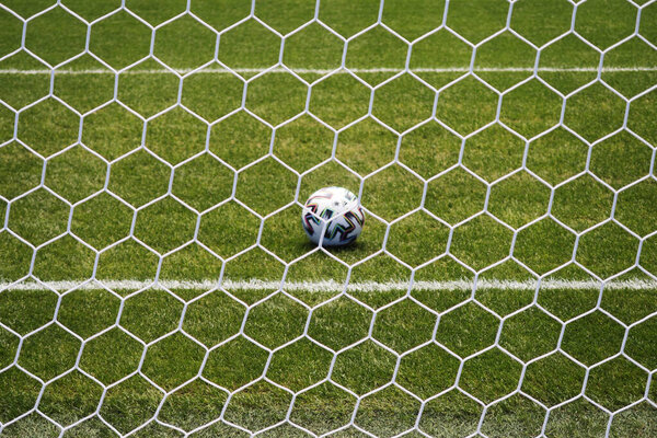 beautiful view of a modern football stadium. Soccer ball on soccer field.