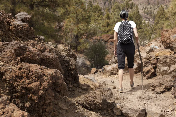 Man and woman hikers trekking in summer mountains. — Stock Photo, Image