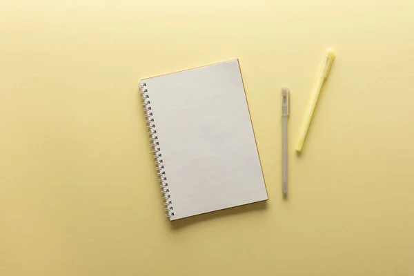 Open spiral notepad on yellow background — Stock Photo, Image