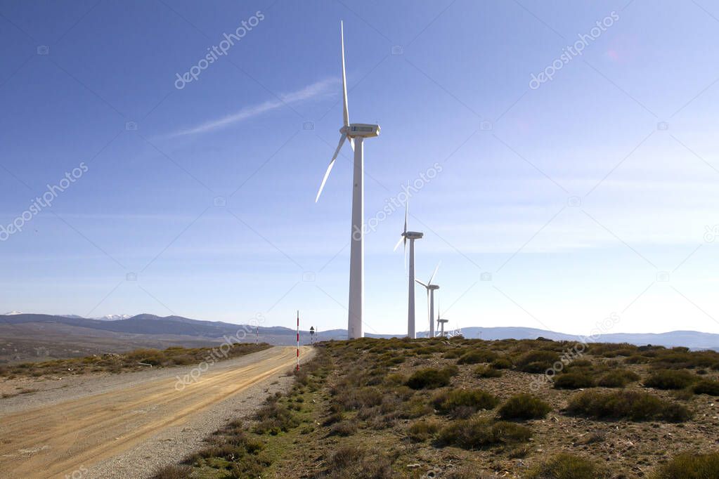 Clean electricity producing wind turbines built on a windy mountain ridge
