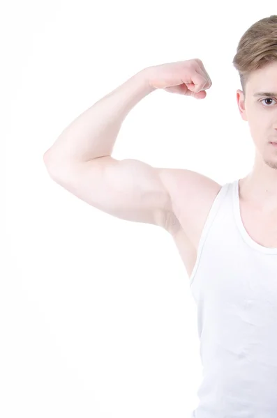 Biceps. Mladý kluk v tělocvičně. — Stock fotografie