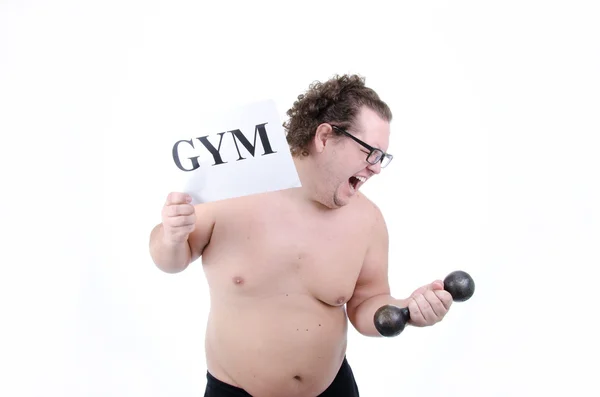 Ett gym och en fet kille. — Stockfoto