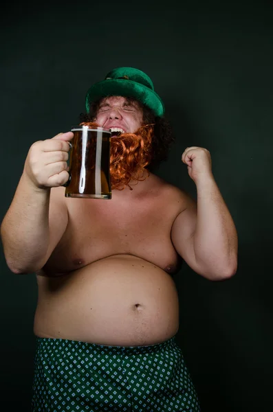 Funny fat man with glass of beer