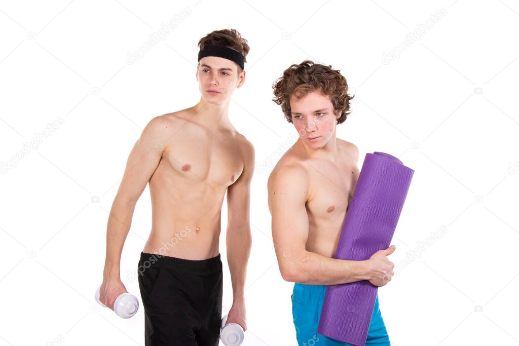 Fitness and healthy lifestyle. Two young attractive students in the gym. White background.