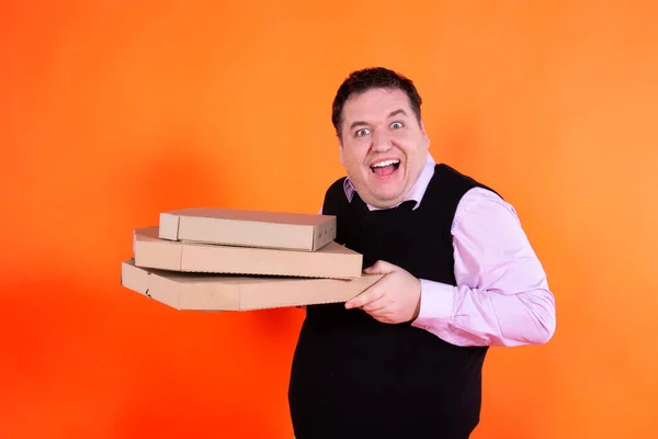 Funny fat man and pizza boxes.