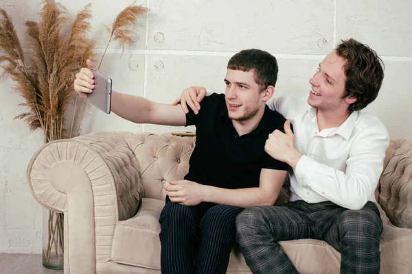 Young Happy Gay Couple Relaxing Home Watching News — Stock Photo, Image