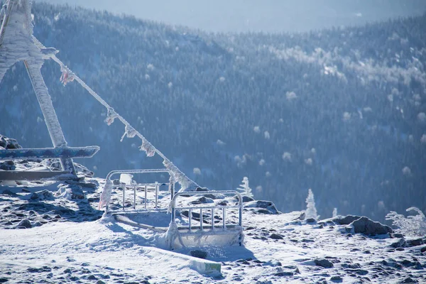 An observation deck in the mountains. Snow-capped mountains.