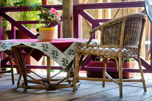 Flower, table and chair on outdoor terrace — Stock Photo, Image