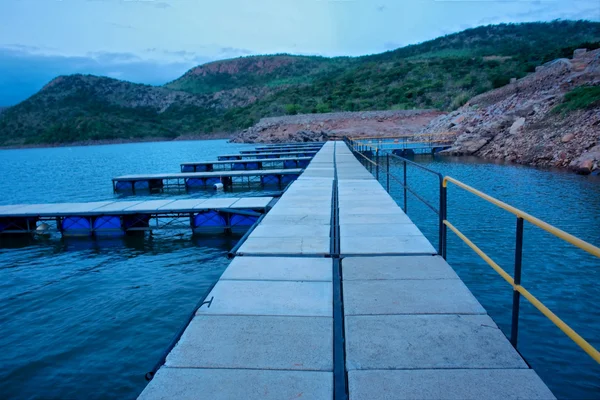 Pier on lake in dusk Royalty Free Stock Photos