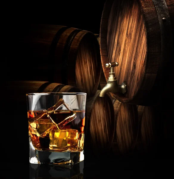 Glass of cognac on the vintage wooden barrel — Stock Photo, Image