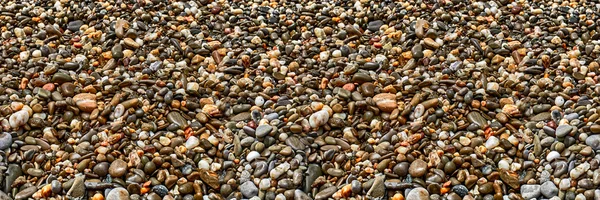 Sea sand texture made of shell and stone pieces. Seamless textur — Stock Photo, Image