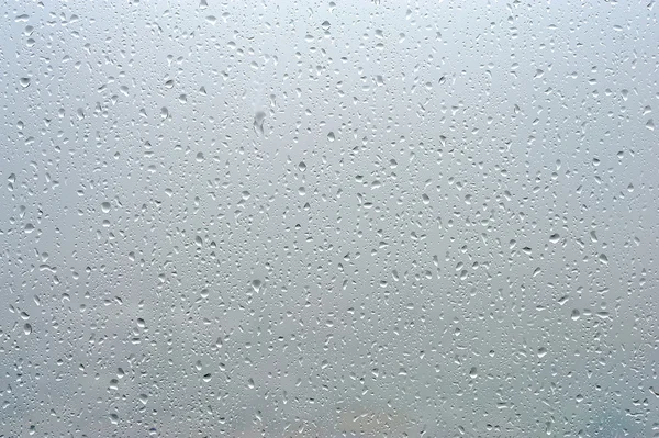Krople deszczu na przezroczyste okno — Zdjęcie stockowe