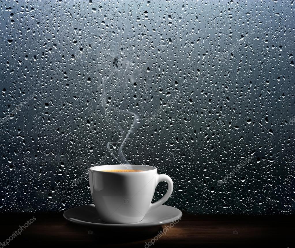 Steaming coffee cup on a rainy day window background Stock Photo ...