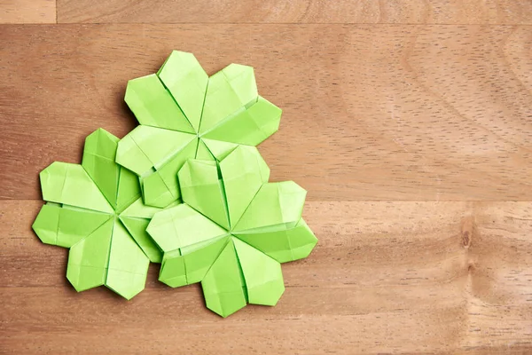 Origami Four Leaf Clovers Made Light Green Paper Wooden Background — Stock Photo, Image