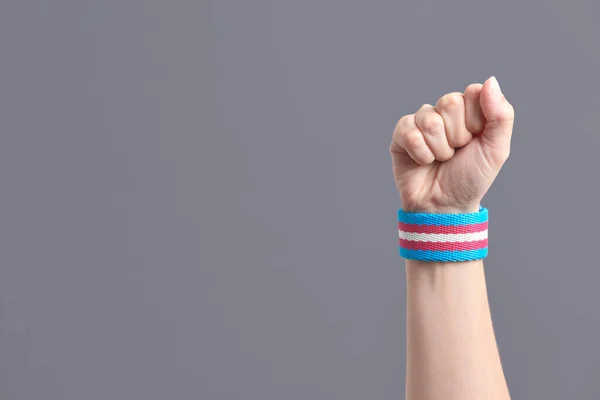 Raised Fist Young Person Wearing Transgender Flag Bracelet Concepts Pride — Zdjęcie stockowe