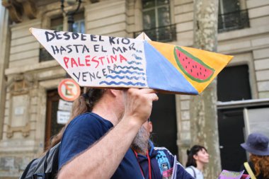 Buenos Aires, Argentina; October 7, 2025: massive protest in support of Palestine against the Israeli Zionist genocide in Gaza. Boat with a text: From the river to the sea, Palestine will prevail.