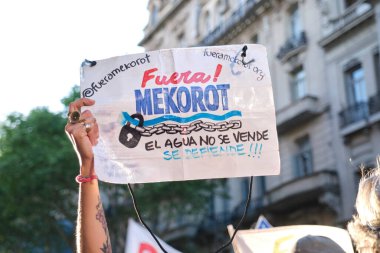 Buenos Aires, Argentina; October 7, 2025: massive protest in support of Palestine against the Israeli zionist genocide in Gaza. Sign: Down with Mekorot! Water is not for sale, it must be defended!