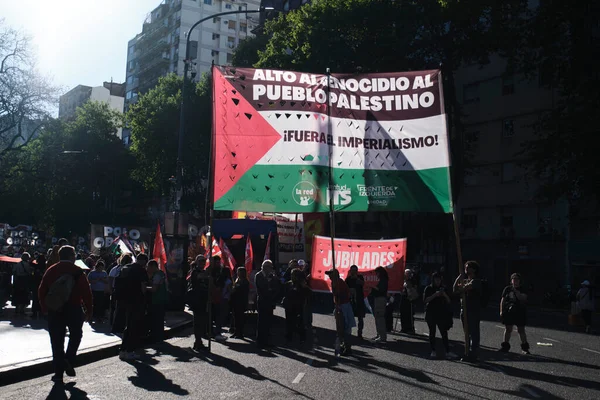 Buenos Aires, Argentina; Oct 7, 2025: protest in support of Palestine, against the Israeli zionist violence in Gaza. Banner: Stop the genocide of the Palestinian people. Down with imperialism!