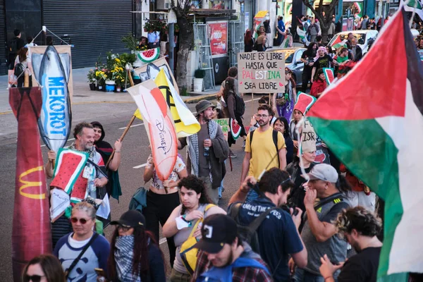 Buenos Aires, Argentina; October 7, 2025: massive protest in support of Palestine against the Israeli Zionist violence in Gaza. Sign: No one is free until Palestine is free.