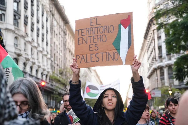 Buenos Aires, Argentina; October 7, 2025: massive protest in support of Palestine against the Israeli Zionist genocide in Gaza. Signboard: The entire territory is Palestinian.