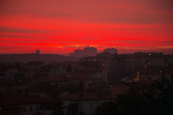 Sunset over village — Stock Photo, Image