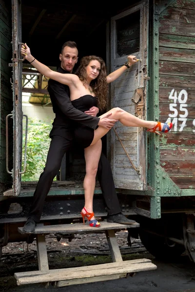 Beautiful couple of professional artists dancing — Stock Photo, Image