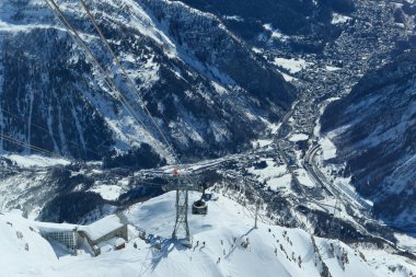 Courmayeur, Italy - February 20, 2020: Alpine cable car Skyway Monte Bianco from Courmayeur to Punta Helbronner with scenic views of Mont Blanc massif and Alps. Aosta Valley.