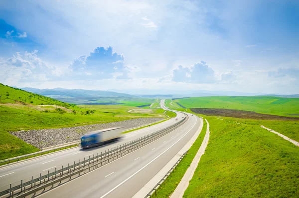 Highway with speeding truck — Stock Photo, Image