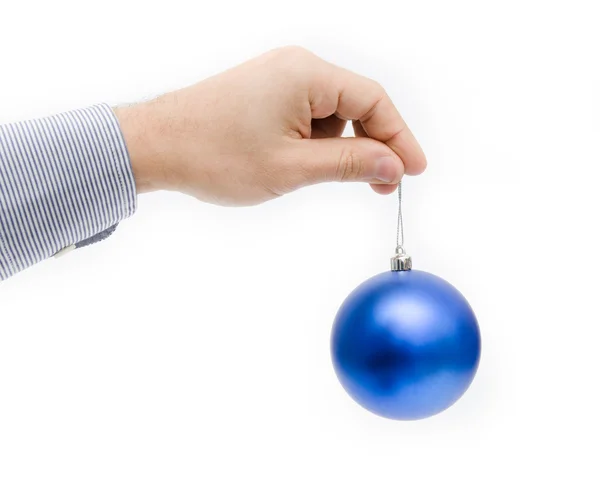 Christmas globe in a business man hand suggesting office holidays — Stock fotografie