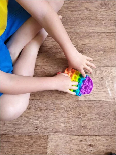Boy Blue Shorts Play Colorful Poppit Fidget Toy Stress Sensory — Stock Photo, Image
