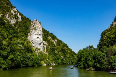 The statue of Decebal Rex at the Danube River in Romania clipart