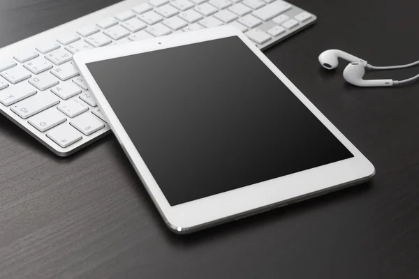 Digital tablet and headphones — Stock Photo, Image