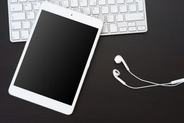 Digital tablet and headphones — Stock Photo, Image