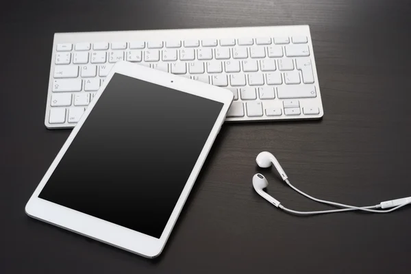 Digital tablet and headphones — Stock Photo, Image