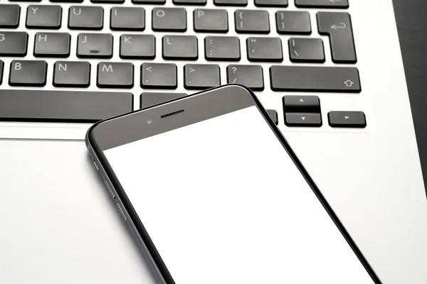 Smartphone and laptop — Stock Photo, Image