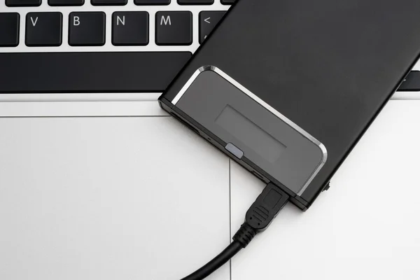 HDD externo sobre portátil — Foto de Stock
