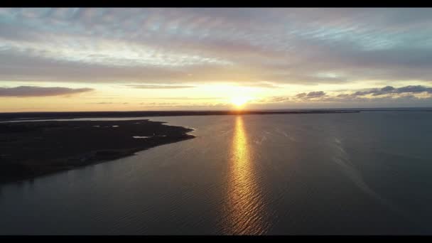 A sunset over a body of water — Stock Video