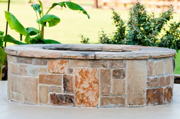 Outdoor flagstone firepit with landscape in background. — Stock Photo, Image