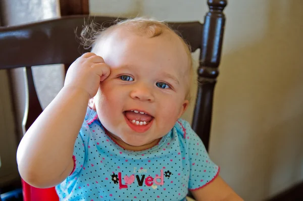 Blue eyes baby girl smiling at camera . — стоковое фото