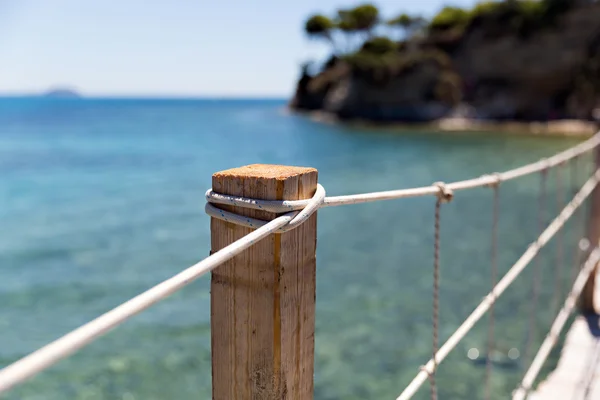 Valla decorativa en la playa junto al mar — Foto de stock © anna